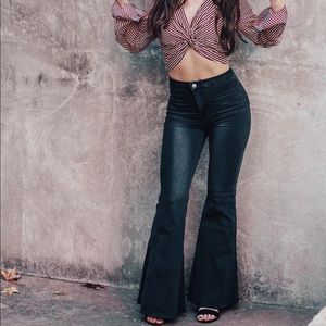 Black bell bottom jeans. Blank Paige